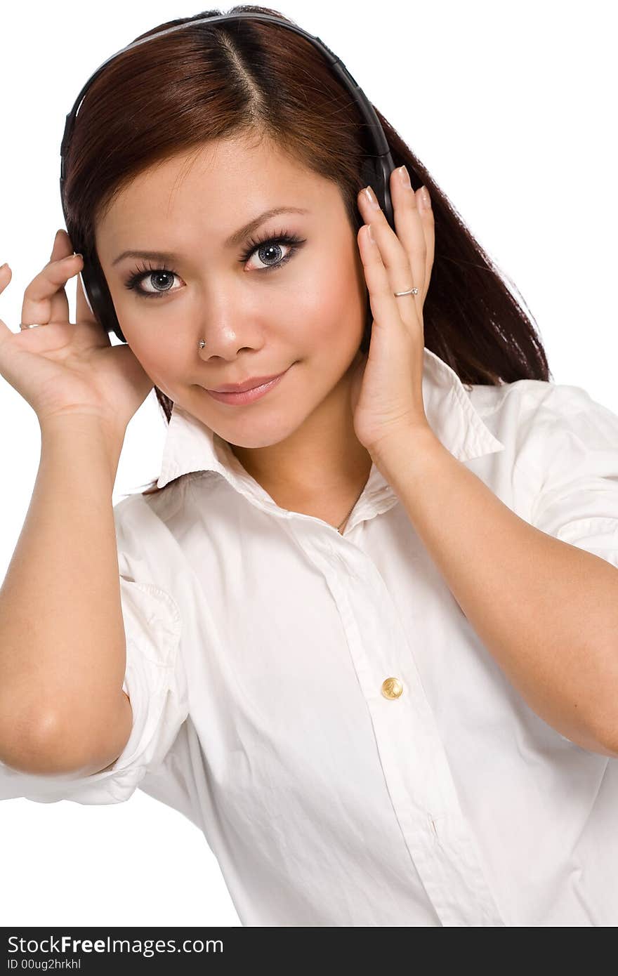 Beautiful girl listening on headphones smiling