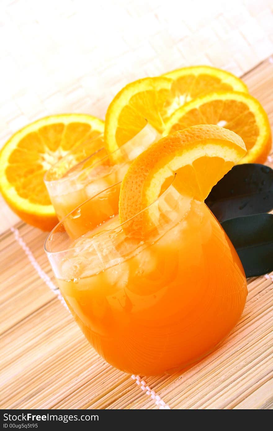 Orange and orange juice in a glass