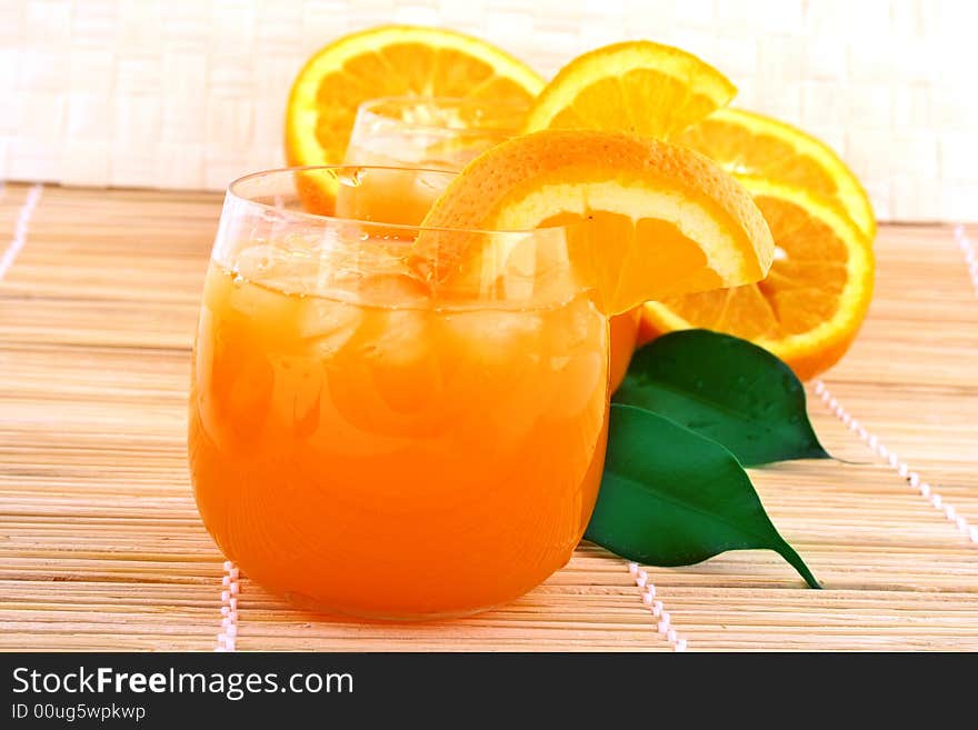 Orange and orange juice in a glass