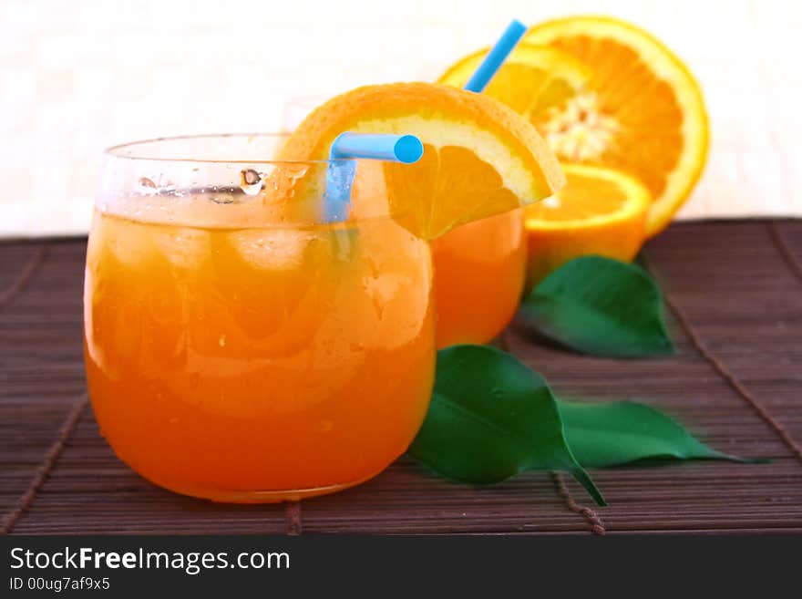 Orange and orange juice in a glass