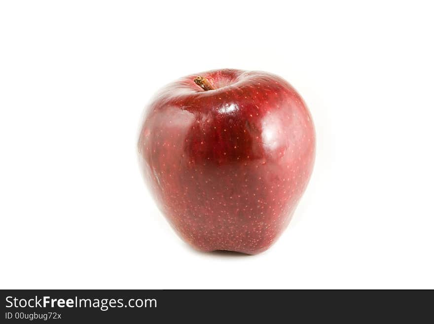 An isolated red apple over white background.