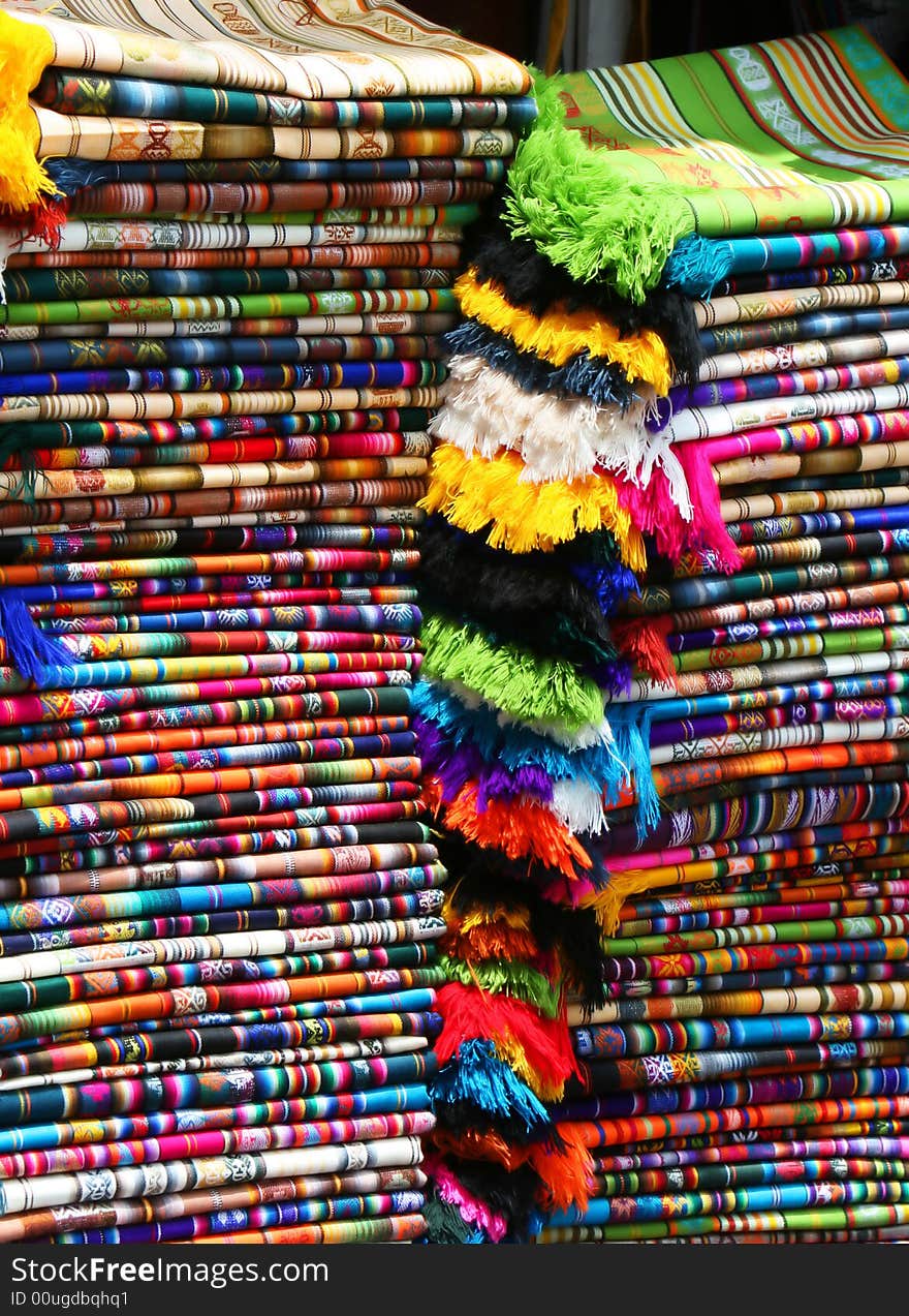 Color fabric patterns stacked at a marketplace. Color fabric patterns stacked at a marketplace