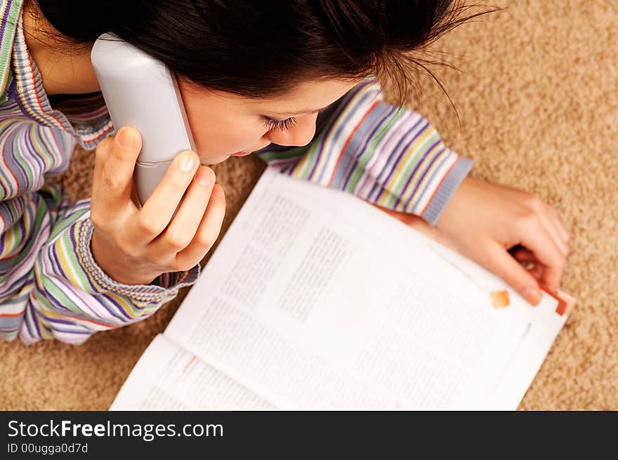 Young woman is speaking on cell phone shallow DOF on face. Young woman is speaking on cell phone shallow DOF on face