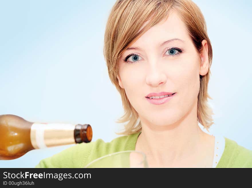 Smiling woman drinking a big glass beer. Smiling woman drinking a big glass beer