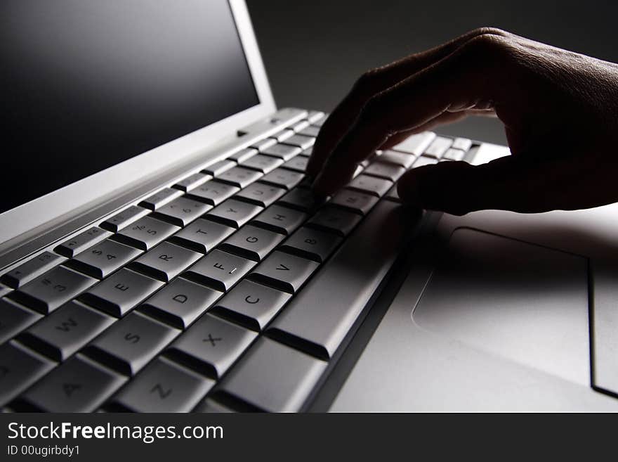 Close up shot of fingers on a laptop keyboard. Close up shot of fingers on a laptop keyboard