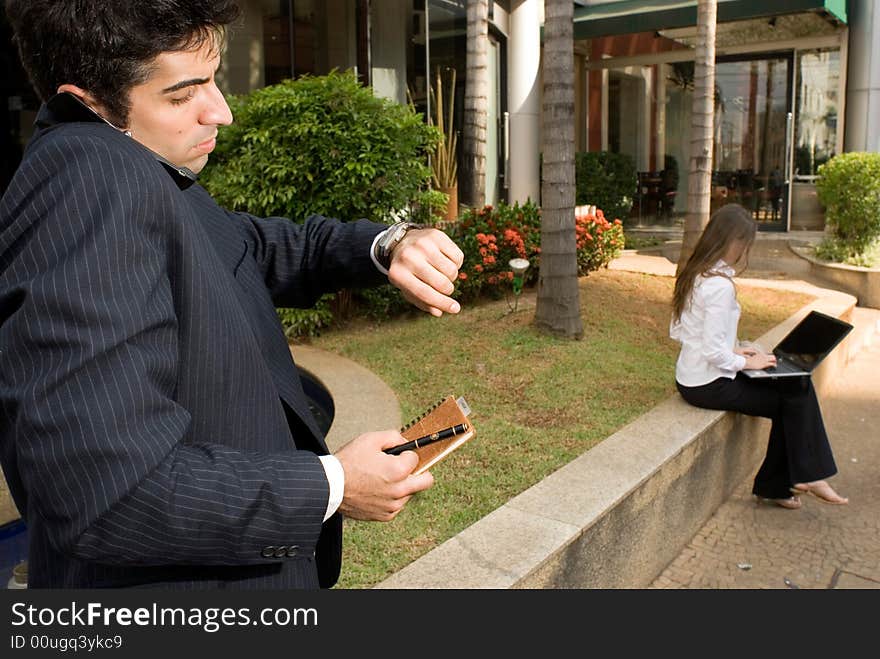 Businessman and woman waiting for a meeting. Businessman and woman waiting for a meeting.