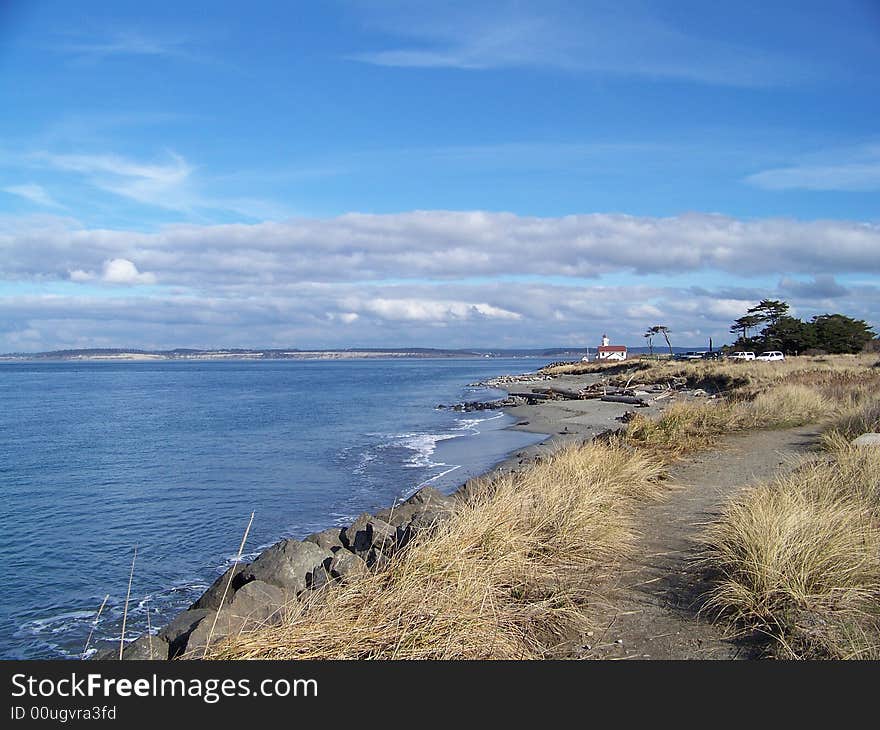 Picture taken on the coast facing towards this distant lighthouse. Picture taken on the coast facing towards this distant lighthouse