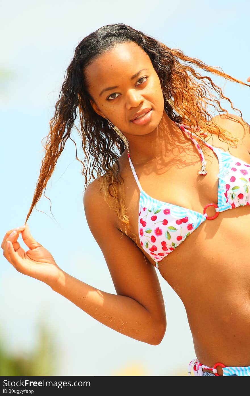 Black woman playing with her hair.