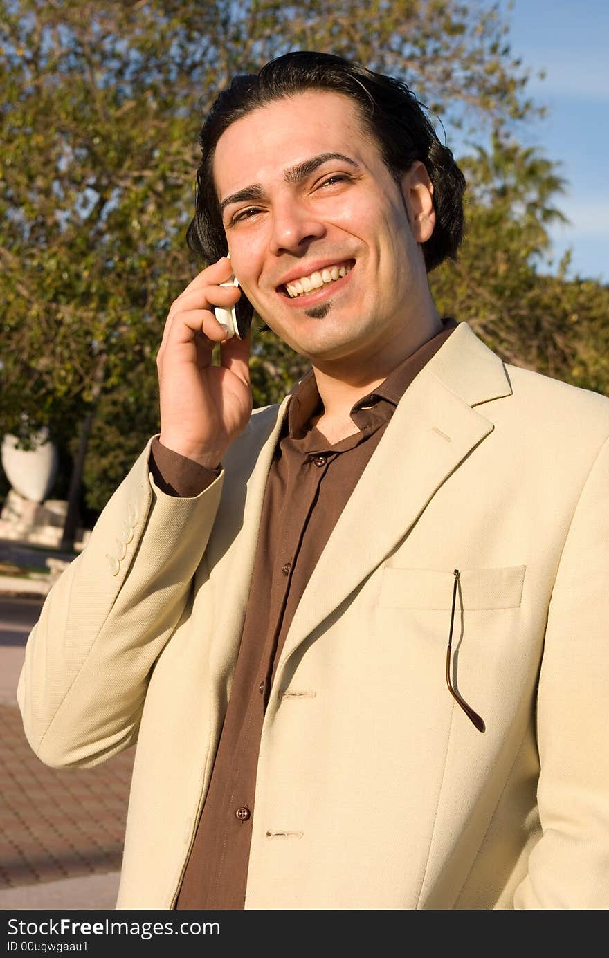 Man with mobile phone in the park. Man with mobile phone in the park