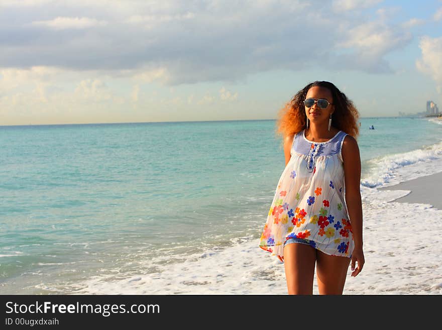 Woman walking by the shore