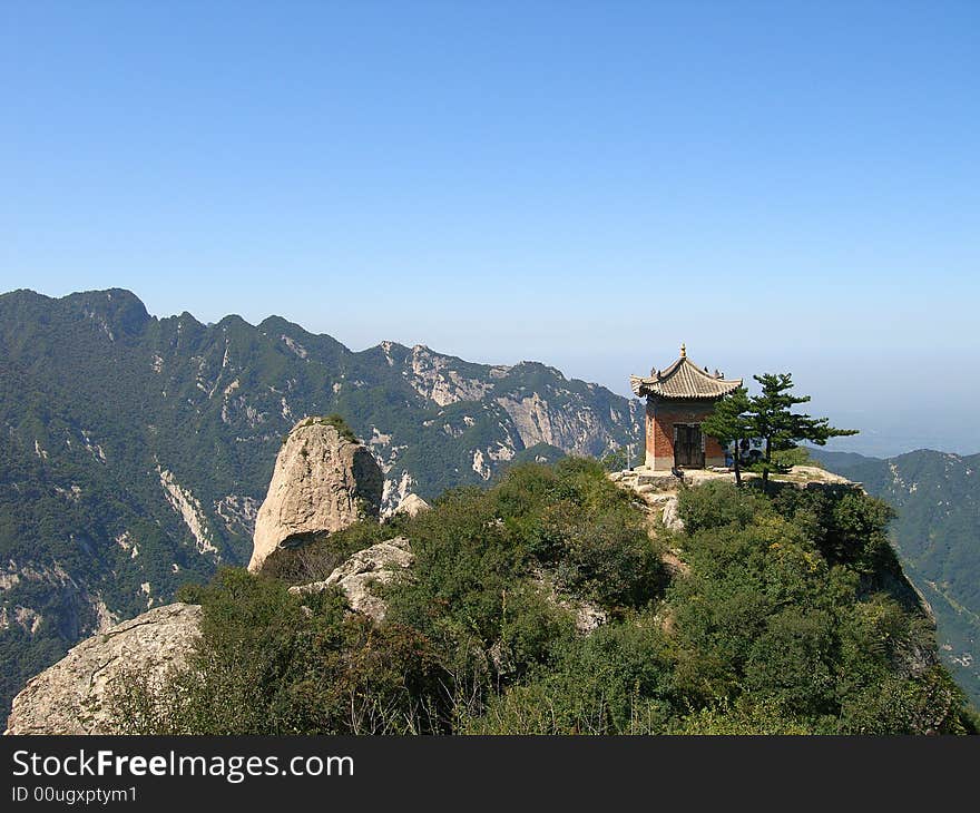 There is a gloriette on the mountaintop under the blue sky use to sacrifice。