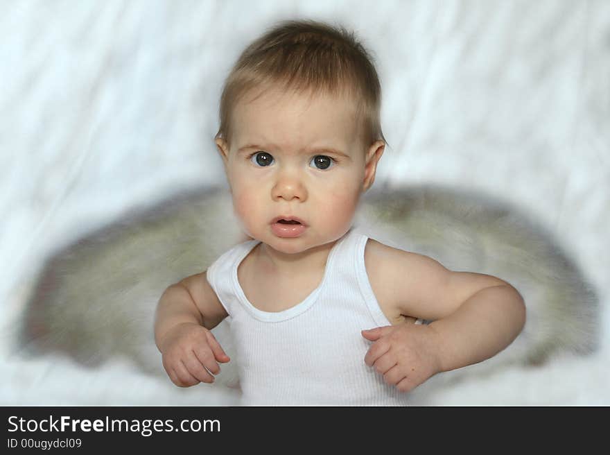 Baby in a white tank with angel wings. Baby in a white tank with angel wings