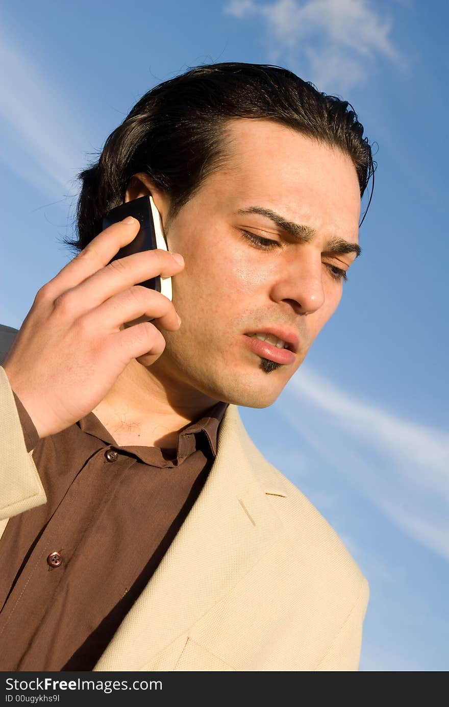 Young man with mobile phone angry. Young man with mobile phone angry