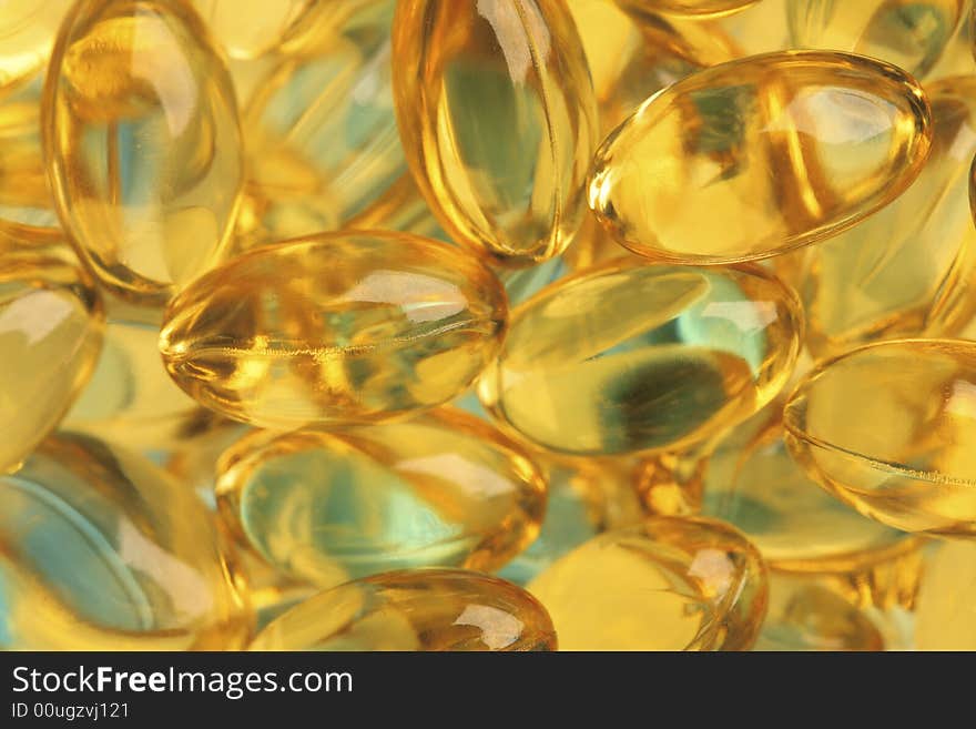 Healthy fish oil nutritional supplements pills / close-up macro. Healthy fish oil nutritional supplements pills / close-up macro