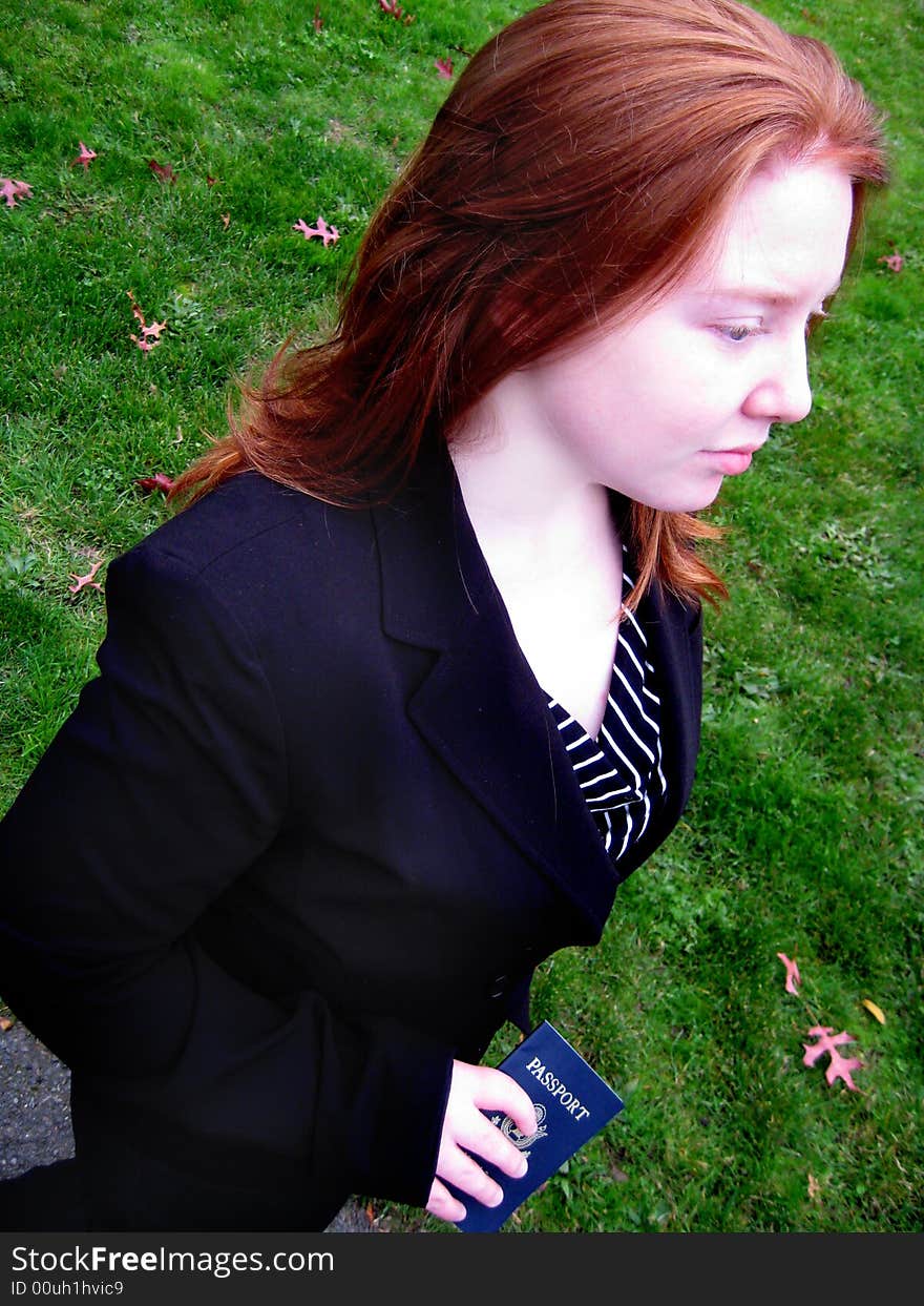 Woman Traveler with Passport v1 is a young redheaded woman with a pale complexion carrying a U.S. Passport.