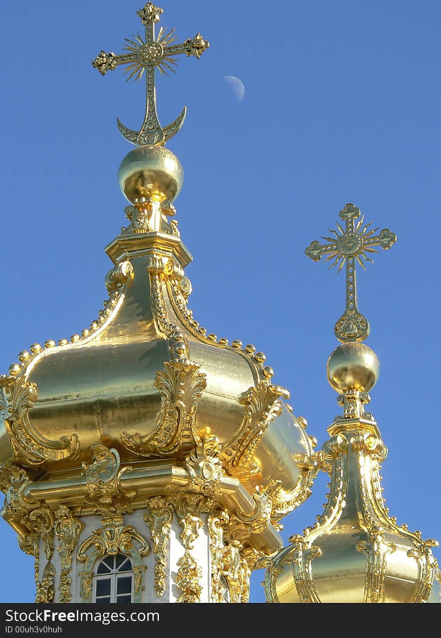 The Golden Cupola on a blue sky in Peterhof, Russia.