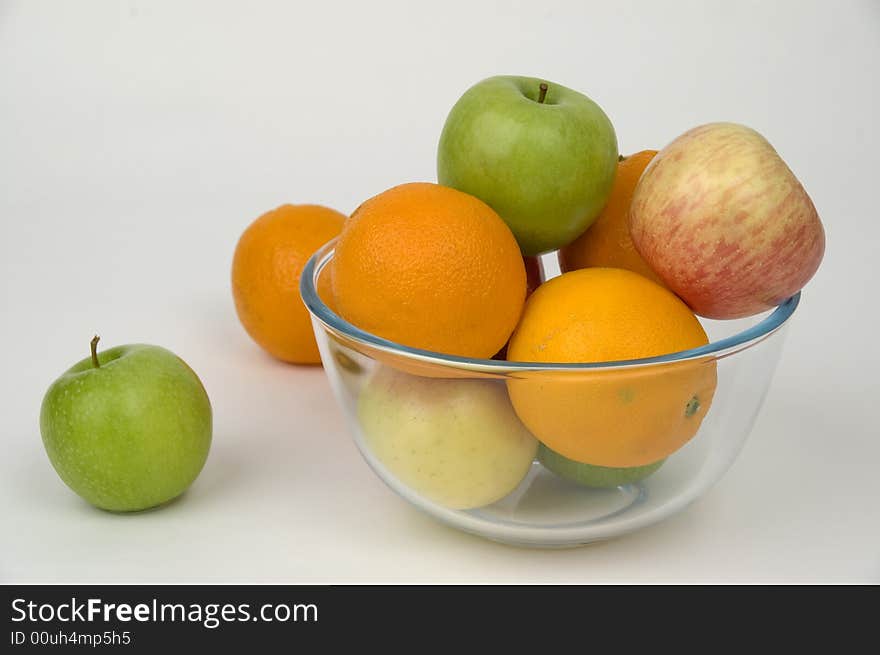 Fresh fruit in glasswares on a white background. Fresh fruit in glasswares on a white background.