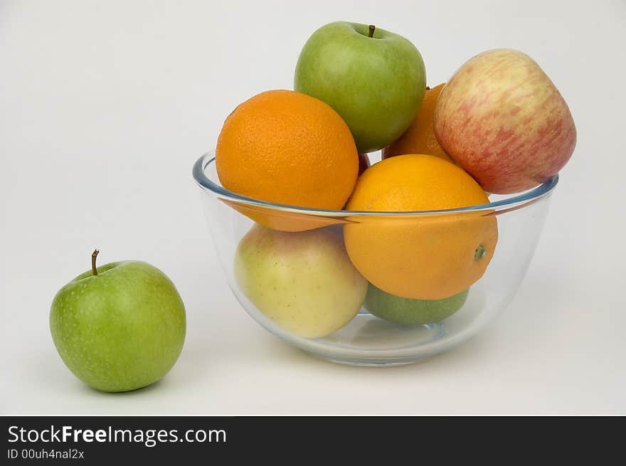 Fresh fruit in glasswares on a white background. Fresh fruit in glasswares on a white background.