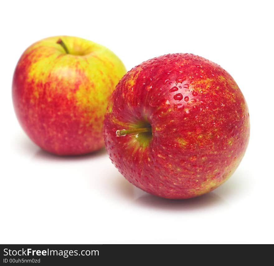 Yellow and red apples on white. A beautiful real shadow, shallow DOF. Yellow and red apples on white. A beautiful real shadow, shallow DOF.