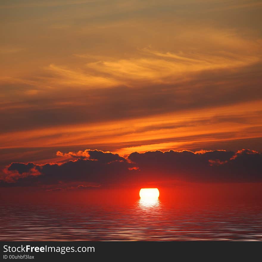 Sunrise in ocean.red sun in clouds