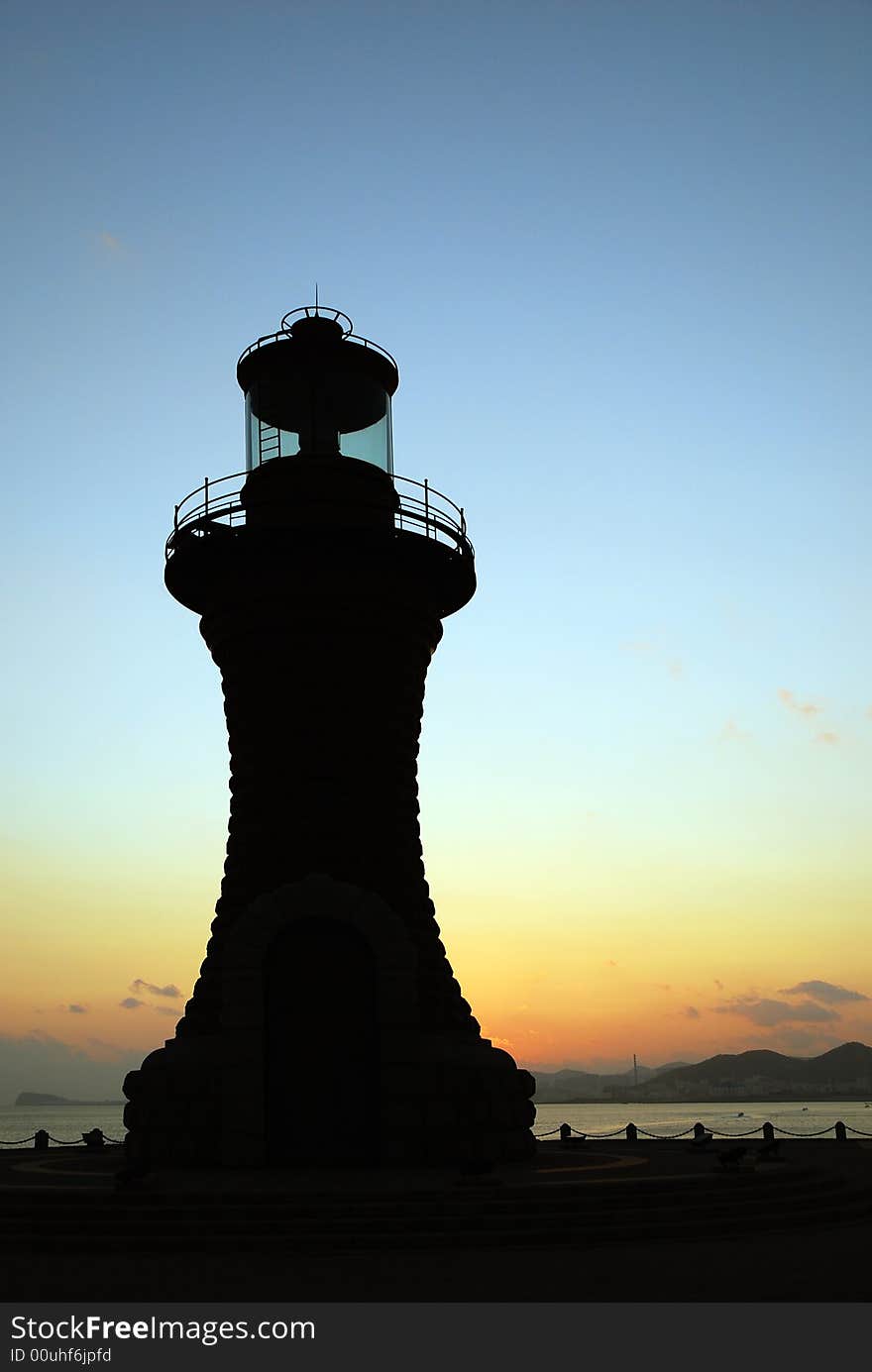 Lighthouse In Sunset