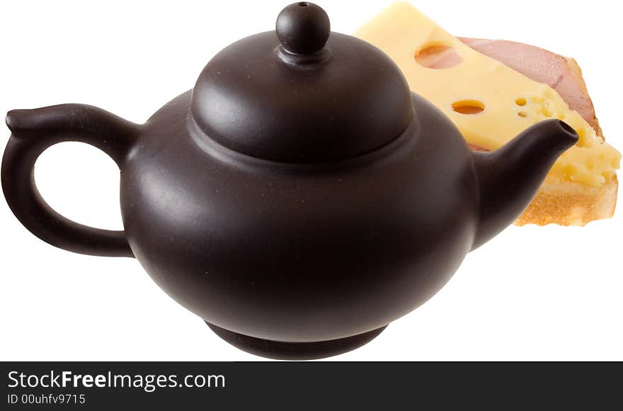 Isolated tasty sandwiche (cheese and meat) and black teapot. Isolated tasty sandwiche (cheese and meat) and black teapot