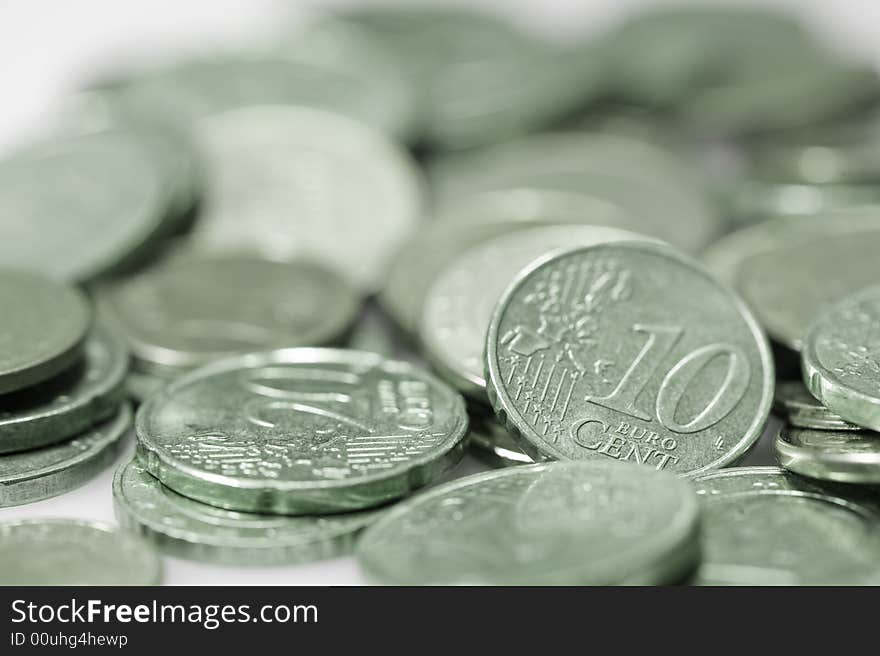 Currency euros. Focus on 10 cent piece. Green. Currency euros. Focus on 10 cent piece. Green.