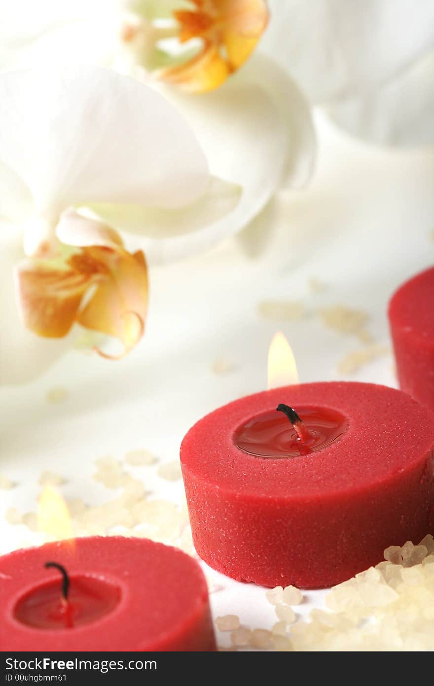 Aromatherapy candles and white orchid