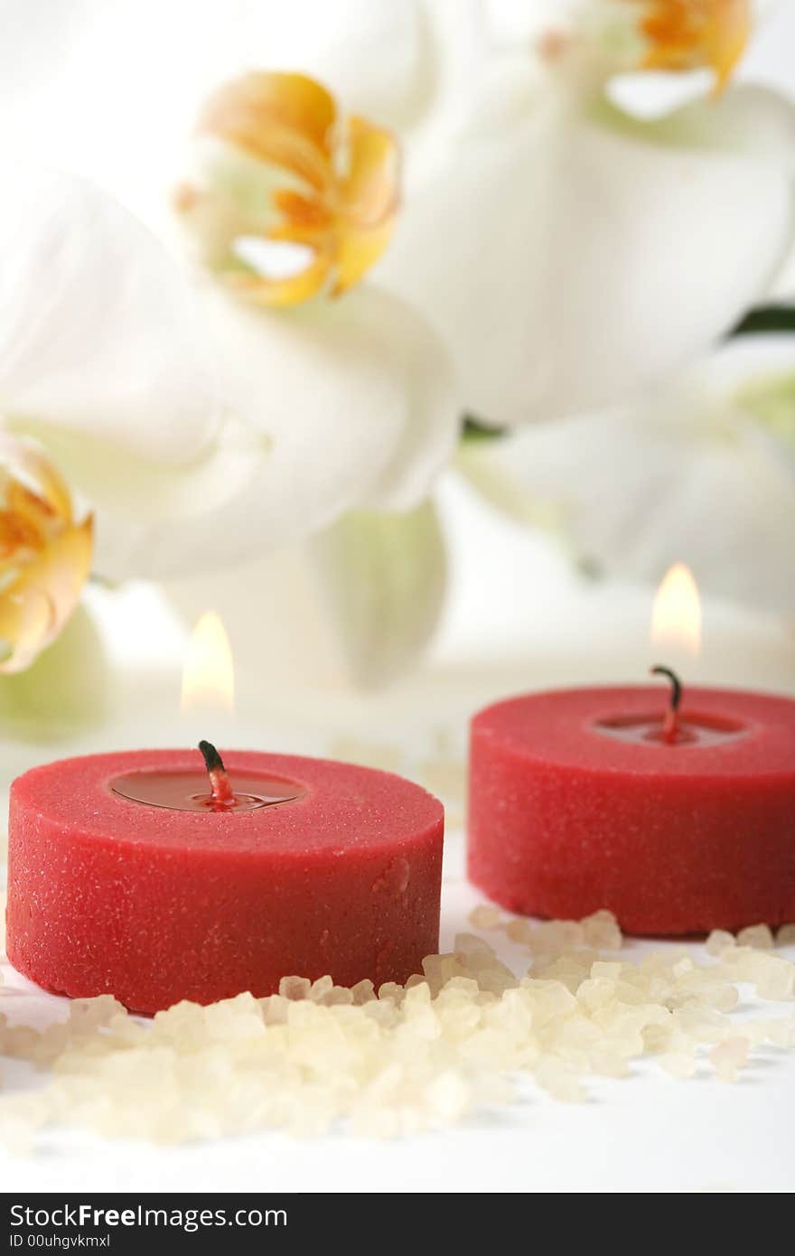 Aromatherapy candles and white orchid