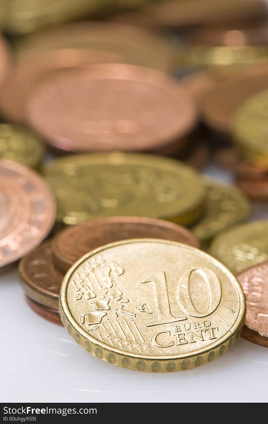 Euros with focus on a 10 cent coin.