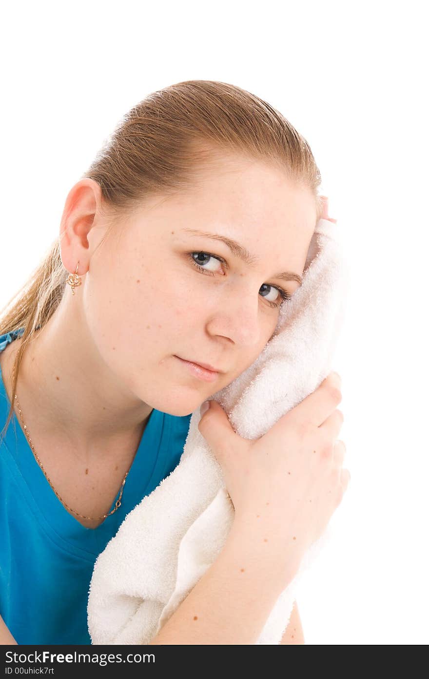 The young woman with the towel isolated on a white