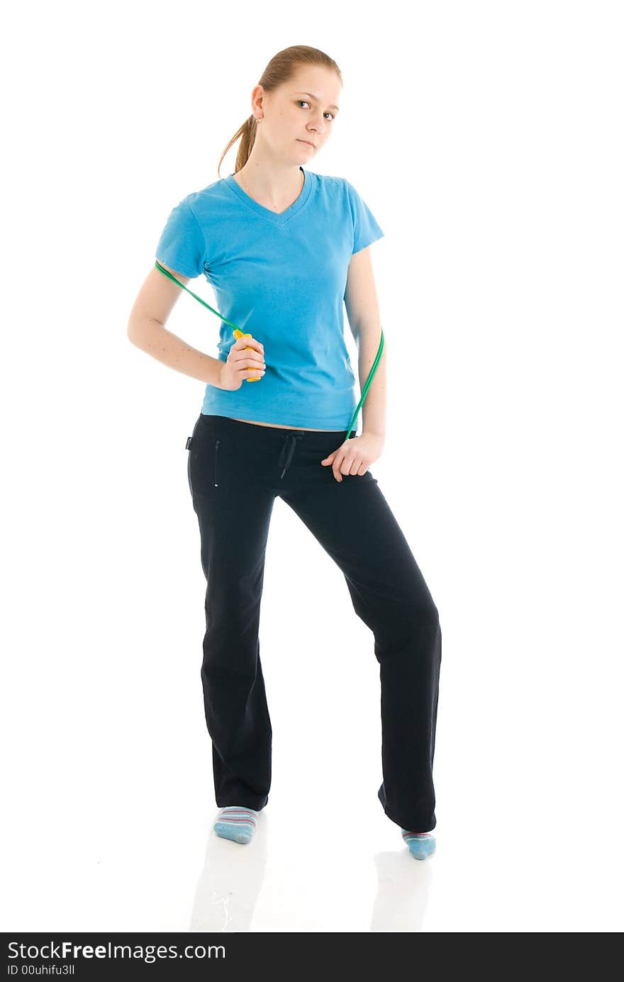 The young woman with the skipping rope isolated on a white background