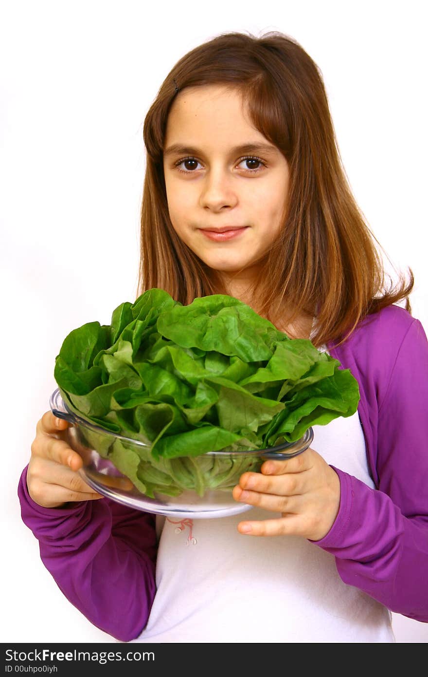 Girl eating a salad a over white background