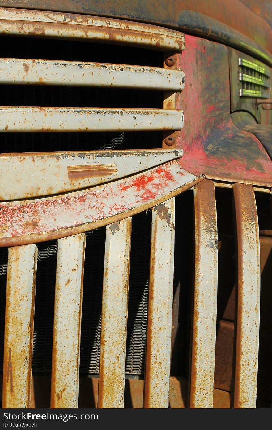 Vintage rust bucket pick-up truck close-up. Vintage rust bucket pick-up truck close-up