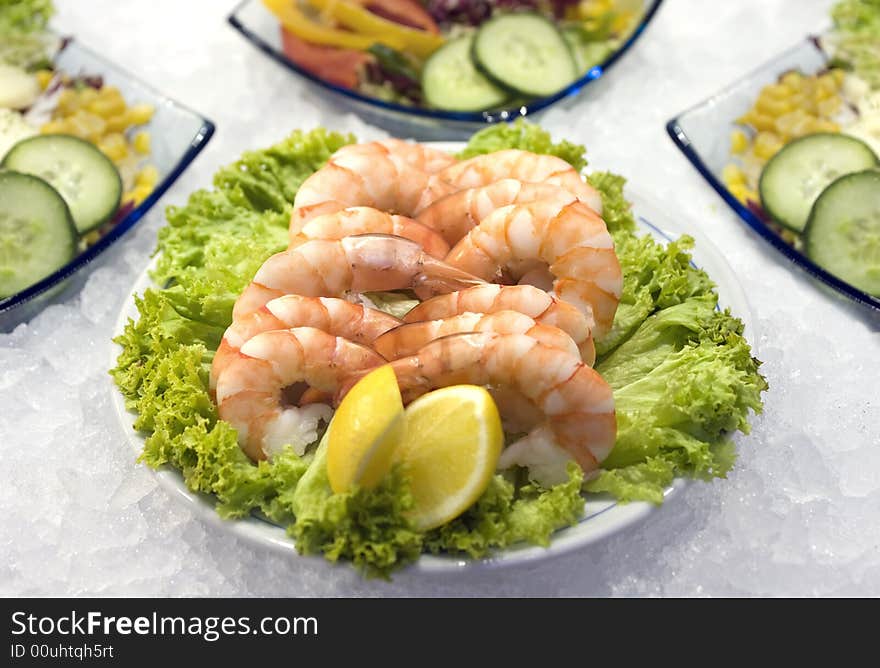 Shrimps salad and bottles closeup. Shrimps salad and bottles closeup