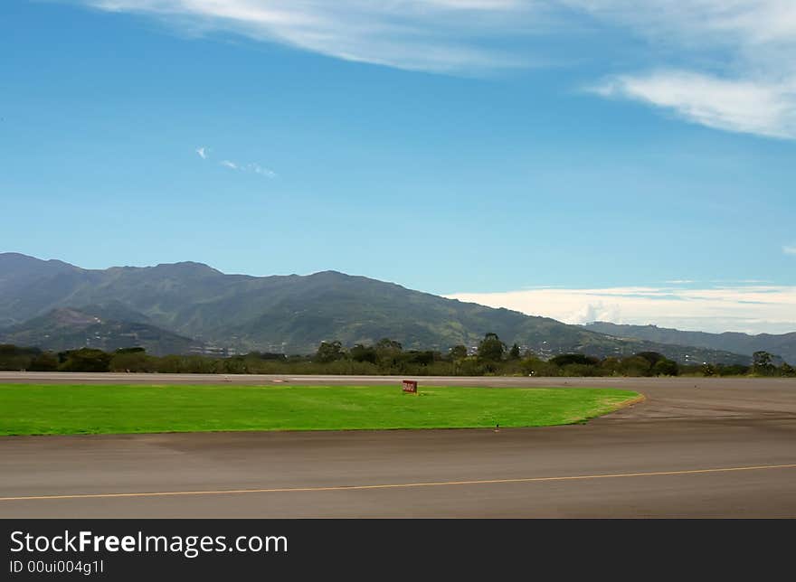 Small airport in mountains over blue sky. Small airport in mountains over blue sky