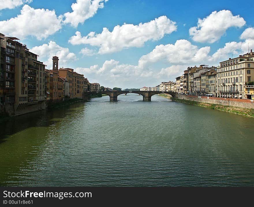 View on Arno river and bridge on it from another bridge. Florence, Italy. View on Arno river and bridge on it from another bridge. Florence, Italy