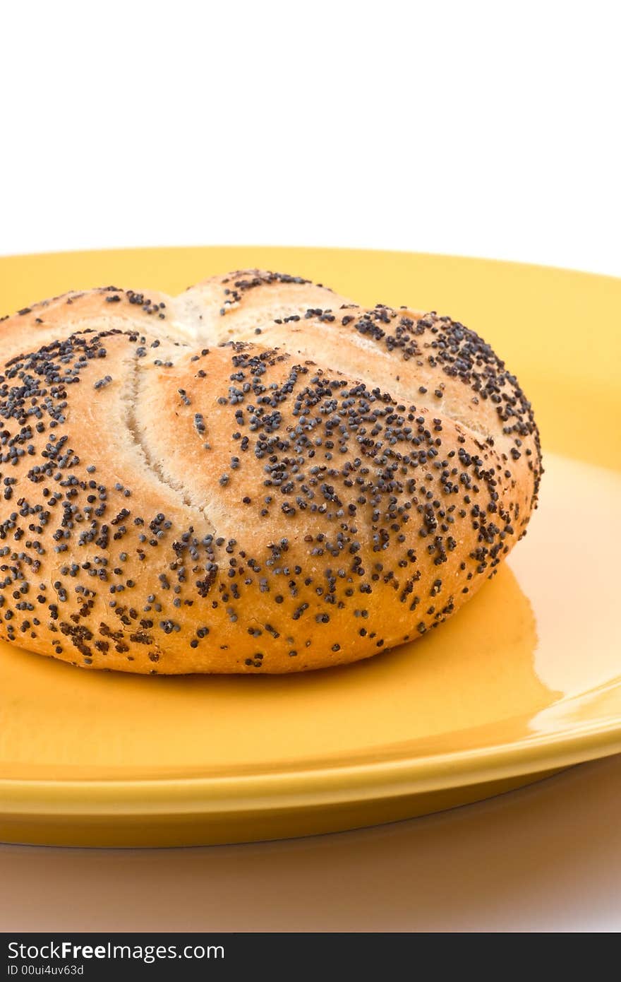 Yellow plate with bread with poppy. Yellow plate with bread with poppy