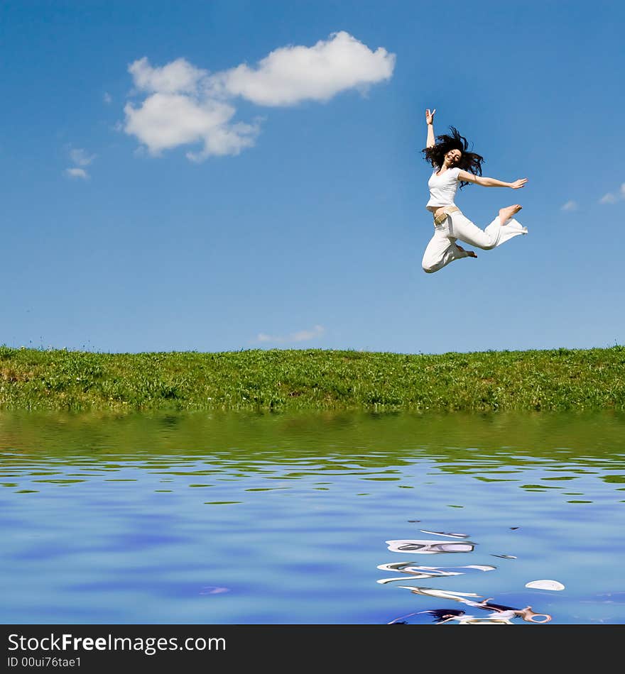 Happy young woman is jumping