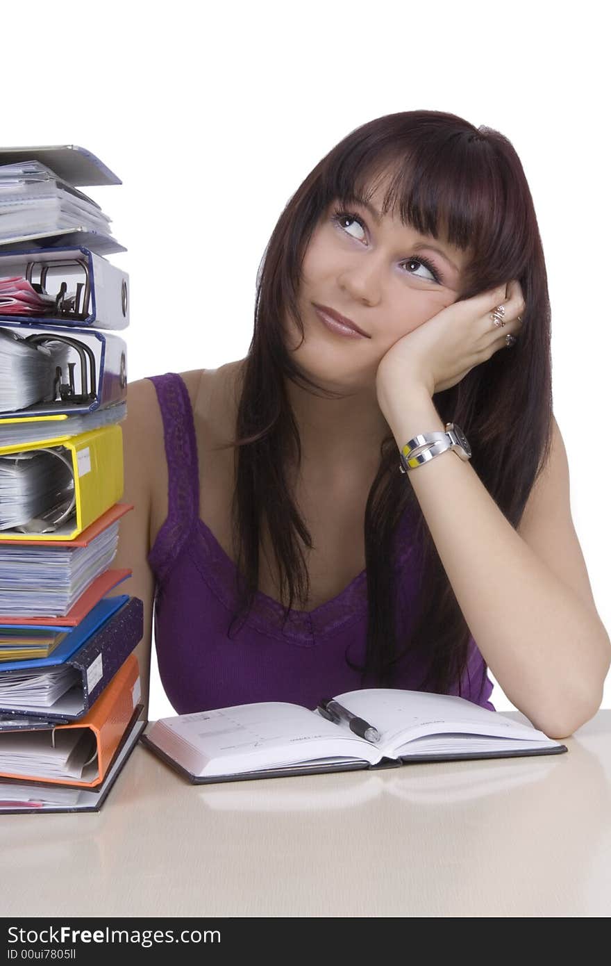 A stressed businesswoman on her office desk. A stressed businesswoman on her office desk