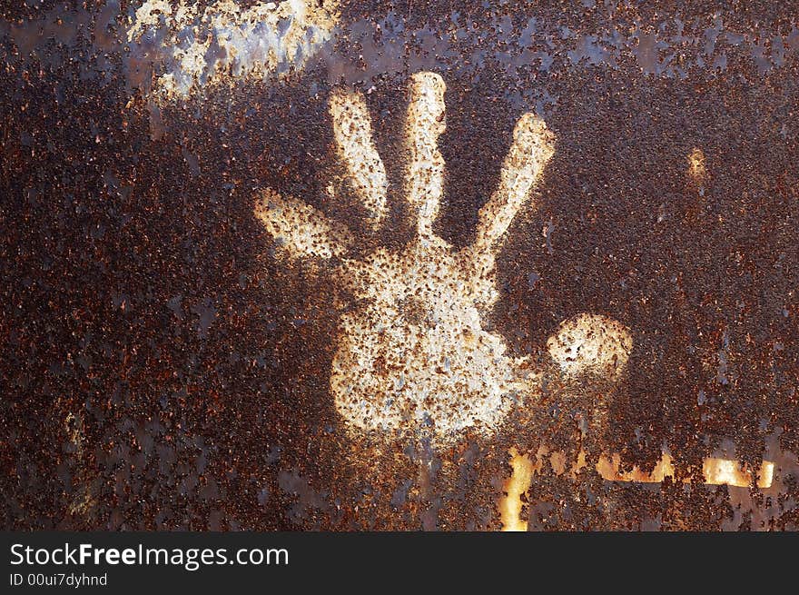 Rusty metal abstract background with handprint. Rusty metal abstract background with handprint