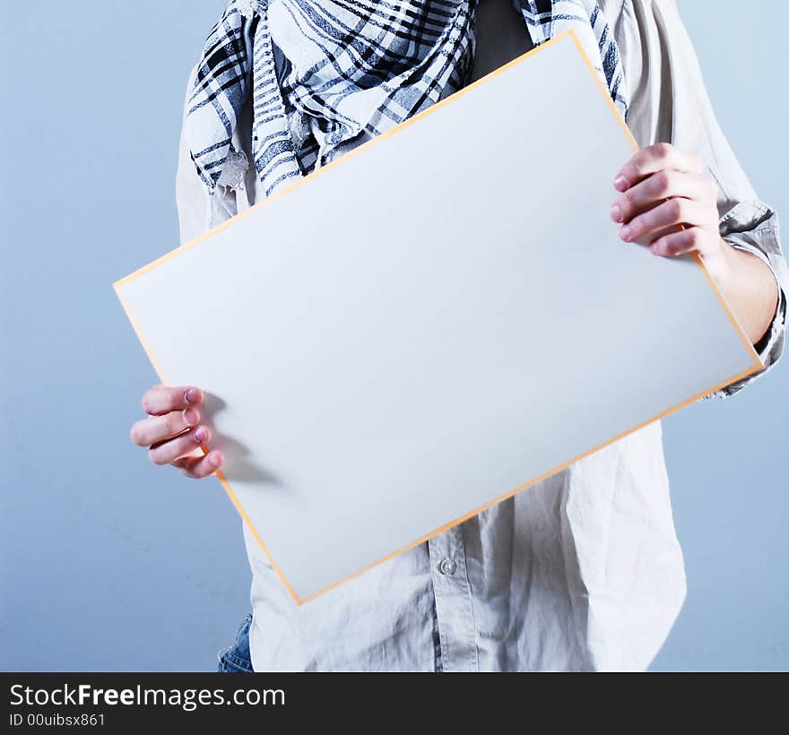 Man takes in hands empty placard. Man takes in hands empty placard