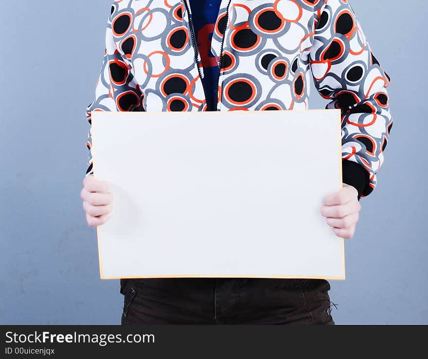 Man takes in hands empty placard. Man takes in hands empty placard