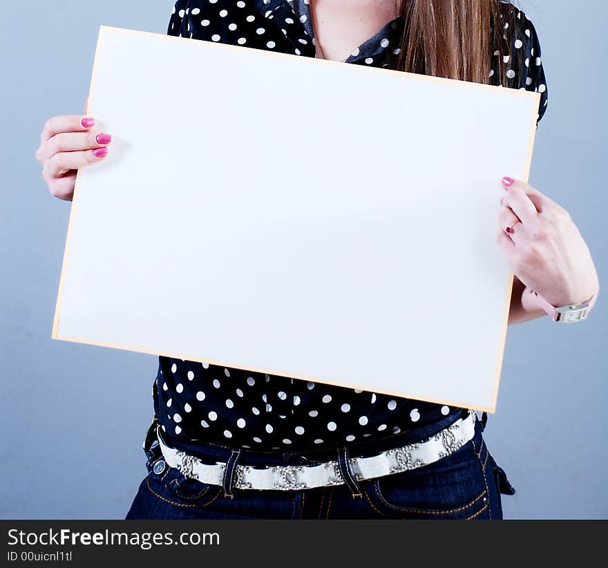 Woman takes in hands empty placard. Woman takes in hands empty placard