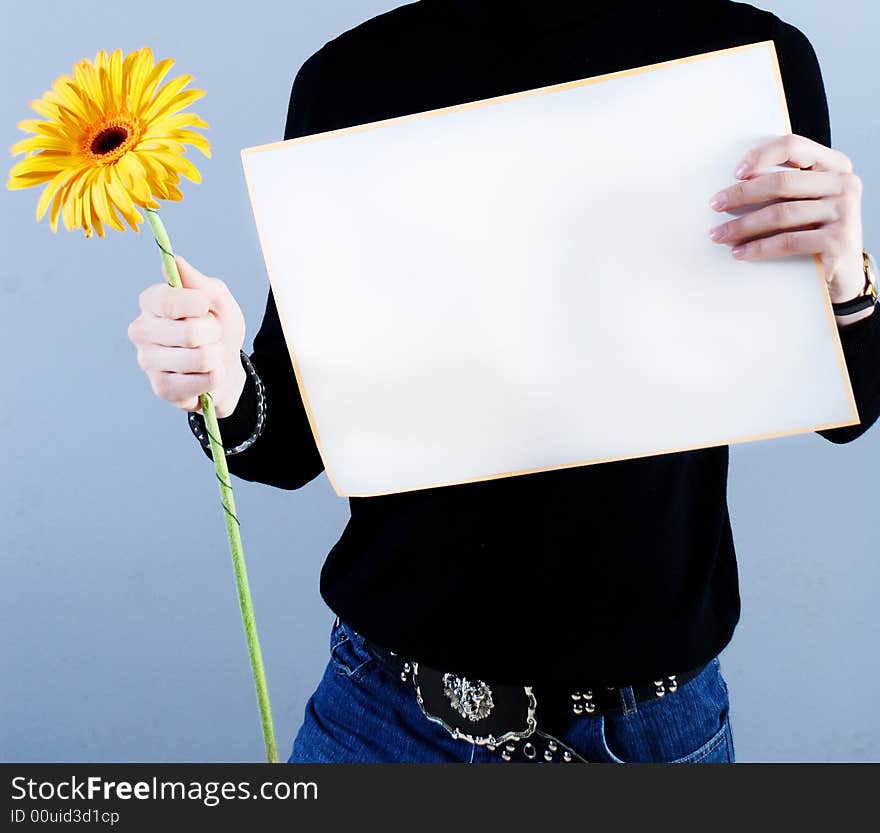 Man takes placard and flower