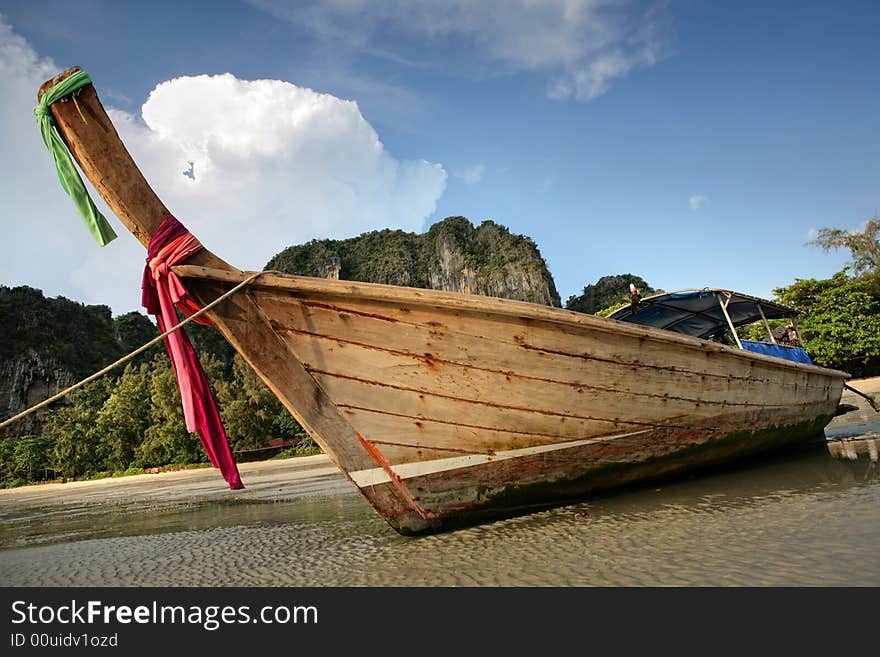 Beautiful longtail boat on the sand seashore. Beautiful longtail boat on the sand seashore