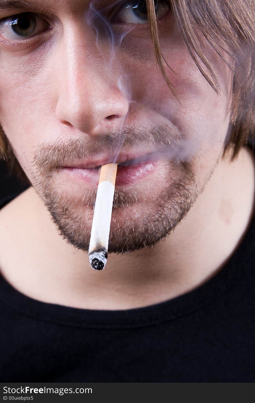 Young man smoking cigarette