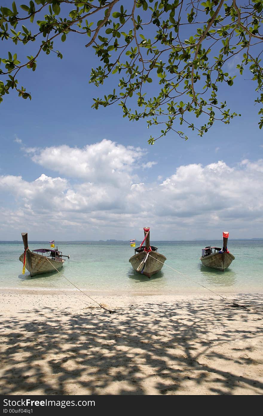 Beautiful longtail boat on the sand seashore. Beautiful longtail boat on the sand seashore