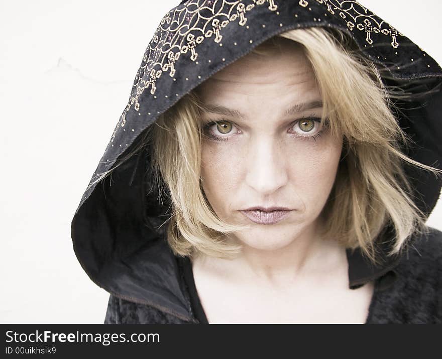 New Age Woman with Green Eyes Wearing a Hood. New Age Woman with Green Eyes Wearing a Hood