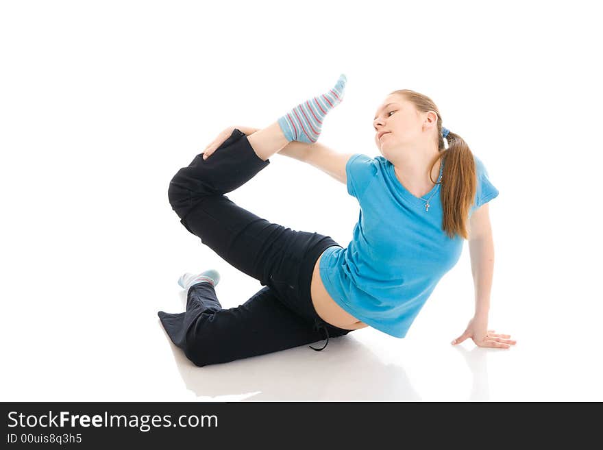 The young woman doing exercise isolated on a white